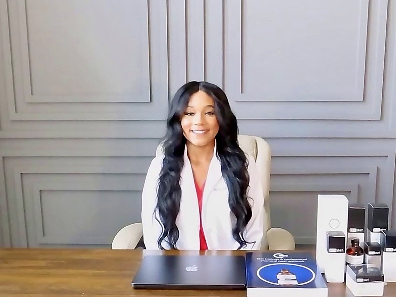 Niya D. Pennie, MSN, RN reviewing skin scans at her desk
